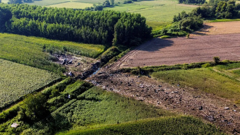 FILE PHOTO: A view of the crash site of an Antonov An-12 cargo plane owned by a Ukrainian company, near Kavala, Greece, July 17, 2022. REUTERS/Alkis Konstantinidis/File Photo