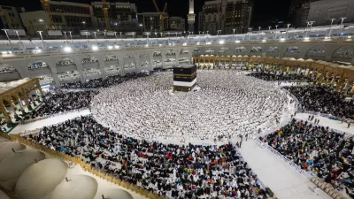 14 June 2024, Saudi Arabia, Mecca: Muslim pilgrims pray in front of al-Ka'ba as the annual Hajj pilgrimage season starts. Photo: -/Saudi Press Agency/dpa