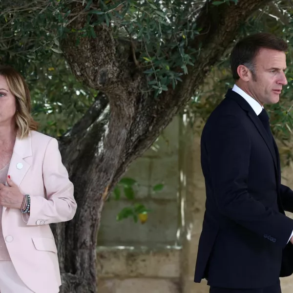 French President Emmanuel Macron walks next to Italy's Prime Minister Giorgia Meloni on the first day of the G7 summit, at the Borgo Egnazia resort, in Savelletri, Italy June 13, 2024. REUTERS/Guglielmo Mangiapane