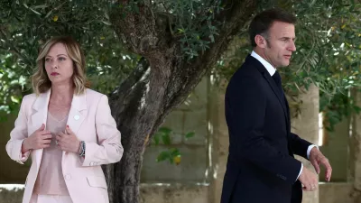 French President Emmanuel Macron walks next to Italy's Prime Minister Giorgia Meloni on the first day of the G7 summit, at the Borgo Egnazia resort, in Savelletri, Italy June 13, 2024. REUTERS/Guglielmo Mangiapane