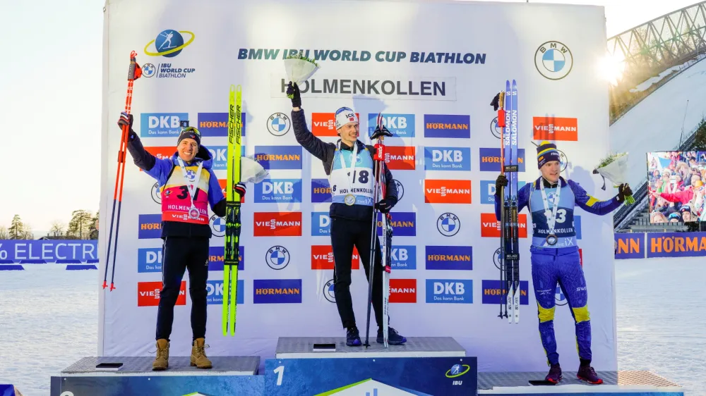 Biathlon - IBU World Cup Holmenkollen - Holmenkollen, Norway - March 18, 2022 Norway's Sturla Holm Laegreid celebrates winning the men's 10km sprint with France's Quentin Fillon Maillet finishing second and Sweden's Sebastian Samuelsson finishing third Terje Bendiksby /NTB via REUTERS  ATTENTION EDITORS - THIS IMAGE WAS PROVIDED BY A THIRD PARTY. NORWAY OUT. NO COMMERCIAL OR EDITORIAL SALES IN NORWAY.