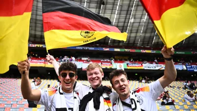 14 June 2024, Bavaria, Munich: Germany fans cheer in the stands ahead of the UEFA Euro 2024 Group A soccer match between Germany and Scotland at Munich Football Arena. Photo: Tom Weller/dpa