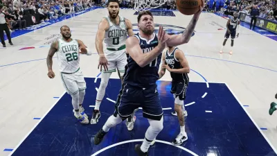 Jun 12, 2024; Dallas, Texas, USA; Dallas Mavericks guard Luka Doncic (77) goes up for a basket against Boston Celtics forward Jayson Tatum (0) during the second half during game three of the 2024 NBA Finals at American Airlines Center. Mandatory Credit: Julio Cortez/Pool Photo-USA TODAY Sports