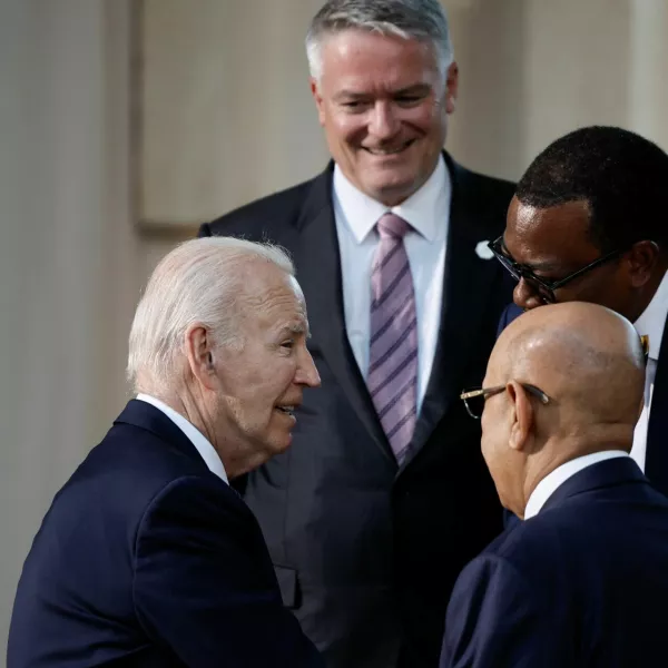 U.S. President Joe Biden, African Development Bank President Akinwumi Adesina, and OECD Secretary General Mathias Cormann stand together, on the second day of the G7 summit at the Borgo Egnazia resort, in Savelletri, Italy June 14, 2024. REUTERS/Louisa Gouliamaki