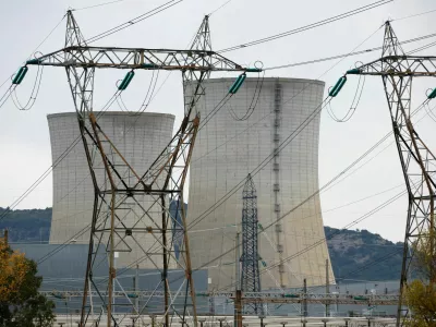 FILE PHOTO: Electrical power pylons of high-tension electricity power lines are seen in front the cooling towers of the Tricastin nuclear power plant site in Saint-Paul-Trois-Chateaux, France, November 21, 2022.  REUTERS/Eric Gaillard/File Photo