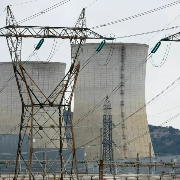 FILE PHOTO: Electrical power pylons of high-tension electricity power lines are seen in front the cooling towers of the Tricastin nuclear power plant site in Saint-Paul-Trois-Chateaux, France, November 21, 2022.  REUTERS/Eric Gaillard/File Photo