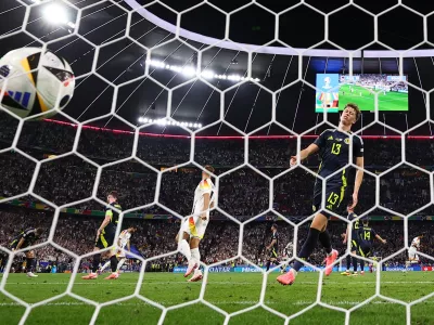 Soccer Football - Euro 2024 - Group A - Germany v Scotland - Munich Football Arena, Munich, Germany - June 14, 2024  Scotland's Jack Hendry reacts after Germany's Emre Can scores their fifth goal REUTERS/Lee Smith