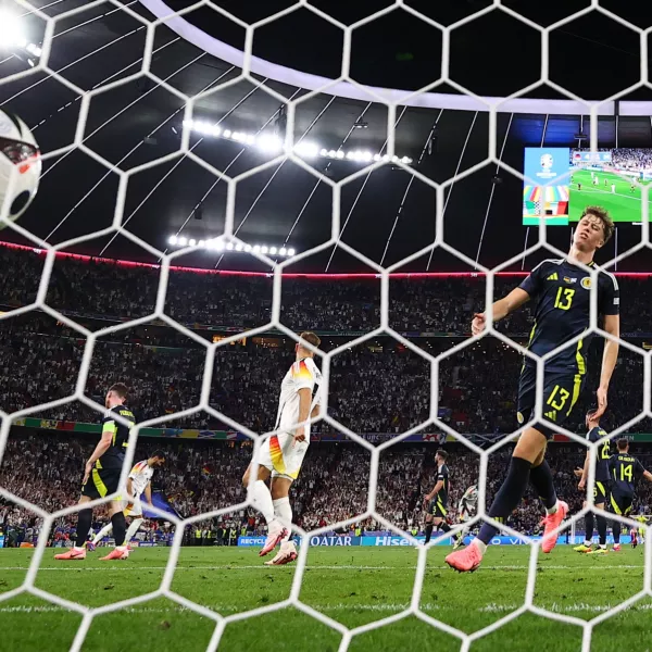 Soccer Football - Euro 2024 - Group A - Germany v Scotland - Munich Football Arena, Munich, Germany - June 14, 2024  Scotland's Jack Hendry reacts after Germany's Emre Can scores their fifth goal REUTERS/Lee Smith