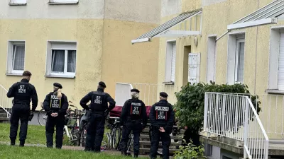 15 June 2024, Saxony-Anhalt, Wolmirstedt: Police officers stand at a scene that may be connected to the attack in Wolmirstedt. Police officers shot and killed a man during an operation in Wolmirstedt, north of Magdeburg, on Friday evening. The man had previously attacked the officers, according to a police spokeswoman in Stendal on 15 June Saturday morning. He reportedly died on the scene. Photo: Thomas Schulz/dpa