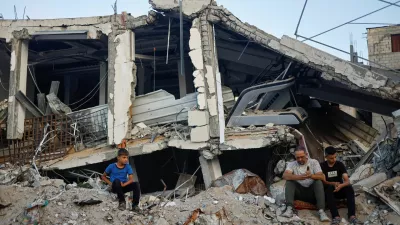 Palestinians attend Eid al-Adha prayers by the ruins of al-Al Rahma mosque destroyed by Israeli air strikes, amid the Israel-Hamas conflict, in Khan Younis, in the southern Gaza Strip, June 16, 2024. REUTERS/Mohammed Salem