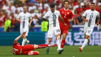 Soccer Football - Euro 2024 - Group C - Slovenia v Denmark - Stuttgart Arena, Stuttgart, Germany - June 16, 2024 Denmark's Pierre-Emile Hojbjerg in action with Slovenia's Petar Stojanovic REUTERS/Lee Smith