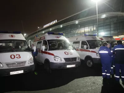 Ambulances are seen outside a terminal at Domodedovo airport, Moscow, Monday, Jan. 24, 2011. An explosion ripped through the international arrivals hall at Moscow's busiest airport on Monday, killing dozens of people and wounding scores, officials said. The Russian president called it a terror attack. (AP Photo/Ivan Sekretarev)