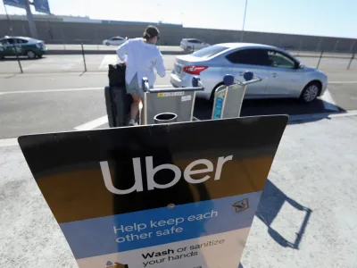 Uber signage is posted at Los Angeles International Airport (LAX) in Los Angeles, California, U.S. July 10, 2022. REUTERS/David Swanson