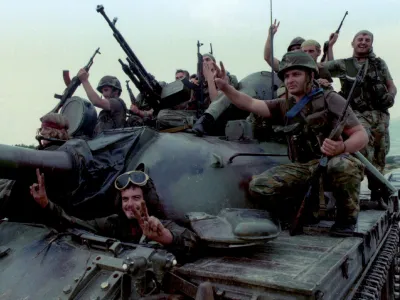 Jubilant Croatian Army troops ride into the captured city of Knin on top of a tank August 5, after a lightning offensive codenamed Operation Thunderstorm caused rebel Serb resistance to crumble. The Bosnian Army's 5th Corps in besieged Bihac also rolled five kilometres into Serb held territory to link with allied Croat forces, effectively ending their three years of isolation.<br>??? OUT - PBEAHUNCTCG