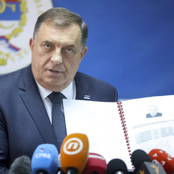 Bosnian Serb political leader Milorad Dodik speaks and shows documents during a press conference in Srebrenica, Bosnia, Thursday, May 23, 2024. Today the United Nations General Assembly will be voting on a draft resolution declaring July 11 the International Day of Reflection and Commemoration of the 1995 genocide in Srebrenica. (AP Photo/Armin Durgut)