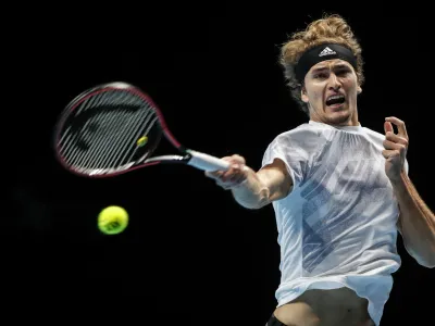 Alexander Zverev of Germany plays a return to Diego Schwartzman of Argentina during their tennis match at the ATP World Finals tennis tournament at the O2 arena in London, Wednesday, Nov. 18, 2020. (AP Photo/Frank Augstein)