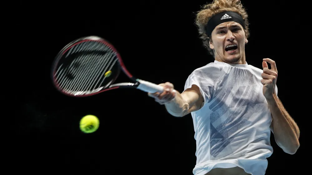 Alexander Zverev of Germany plays a return to Diego Schwartzman of Argentina during their tennis match at the ATP World Finals tennis tournament at the O2 arena in London, Wednesday, Nov. 18, 2020. (AP Photo/Frank Augstein)