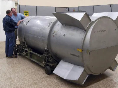 Workers examine a B53 nuclear bomb at the B&W Pantex nuclear weapons storage facility outside Amarillo, Texas, in this handout photograph taken and released on October 25, 2011. The United States dismantled the oldest nuclear bomb in its Cold War arsenal -- and one of the most powerful it ever built -- on Tuesday as part of President Barack Obama's nuclear security policy. Built at the height of the Cold War in 1962, the bomb was designed to be dropped onto a target by a massive B-52 Stratofortress strategic bomber. REUTERS/Photo Courtesy B&W Pantex/Handout (UNITED STATES - Tags: MILITARY SCIENCE TECHNOLOGY) FOR EDITORIAL USE ONLY. NOT FOR SALE FOR MARKETING OR ADVERTISING CAMPAIGNS. THIS IMAGE HAS BEEN SUPPLIED BY A THIRD PARTY. IT IS DISTRIBUTED, EXACTLY AS RECEIVED BY REUTERS, AS A SERVICE TO CLIENTS