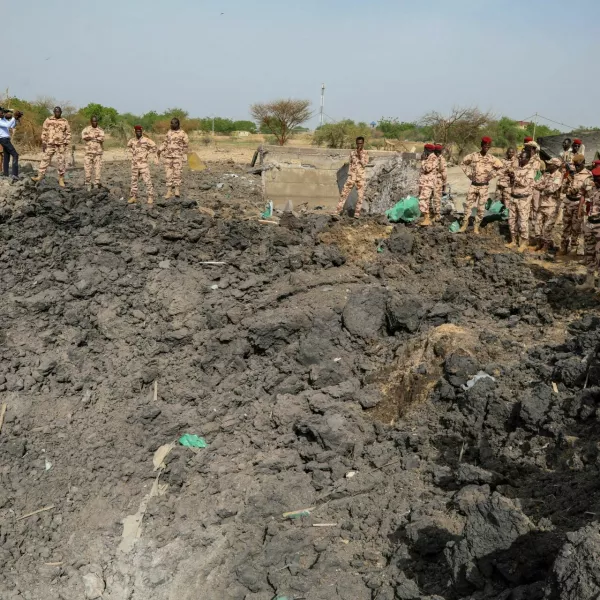 Army officers stand around blast damages after last night's fire that caused blasts at a military ammunition depot in N'Djamena, Chad June 19, 2024. REUTERS/Israel Matene