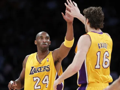 Los Angeles Lakers' Kobe Bryant (L) is congratulated by teammate Pau Gasol of Spain during their NBA basketball game against the Toronto Raptors in Los Angeles, California November 5, 2010. REUTERS/Lucy Nicholson (UNITED STATES - Tags: SPORT BASKETBALL)