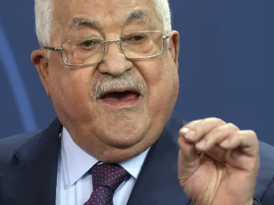 Palestinian President Mahmoud Abbas speaks during a news conference after a meeting with German Chancellor Olaf Scholz at the Chancellery in Berlin, Tuesday, Aug. 16, 2022. German Chancellor Olaf Scholz said on Wednesday, Aug. 17, 2022, that "For us Germans in particular, any relativization of the singularity of the Holocaust is intolerable and unacceptable. I condemn any attempt to deny the crimes of the Holocaust." (Wolfgang Kumm/dpa via AP)