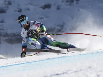 Slovenia's Martin Cater speeds down the course during an alpine ski, men's World Cup downhill race, in Wengen, Switzerland, Saturday, Jan. 15, 2022. (AP Photo/Gabriele Facciotti)