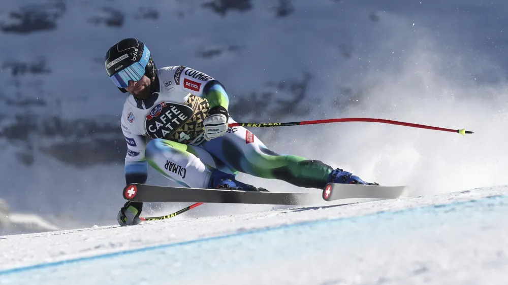 Slovenia's Martin Cater speeds down the course during an alpine ski, men's World Cup downhill race, in Wengen, Switzerland, Saturday, Jan. 15, 2022. (AP Photo/Gabriele Facciotti)