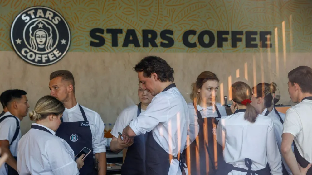 Staff members get ready for the launching of the new coffee shop "Stars Coffee", which opens following Starbucks Corp company's exit from the Russian market, in Moscow, Russia August 18, 2022. REUTERS/Maxim Shemetov   TPX IMAGES OF THE DAY