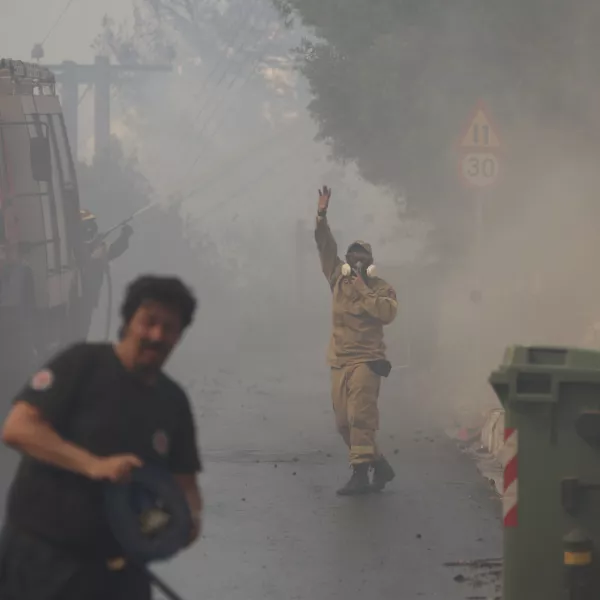 Firefighters operate during a wildfire in Voula suburb, in southern Athens, Greece, Saturday, June 4, 2022. A combination of hot, dry weather and strong winds makes Greece vulnerable to wildfire outbreaks every summer. (AP Photo/Yorgos Karahalis)