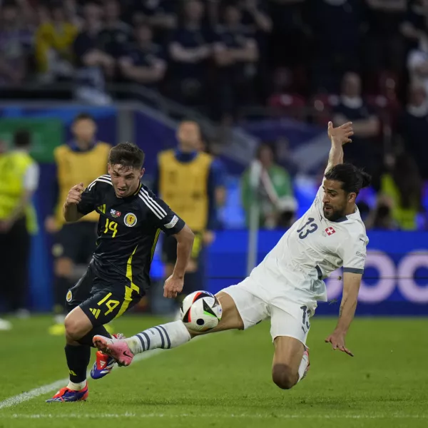 Switzerland's Ricardo Rodriguez, right, fouls Scotland's Billy Gilmour during a Group A match between Scotland and Switzerland at the Euro 2024 soccer tournament in Cologne, Germany, Wednesday, June 19, 2024. (AP Photo/Alessandra Tarantino)