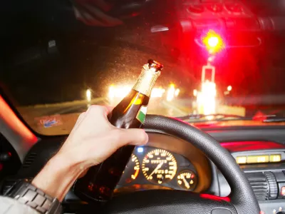 drinking beer while driving car