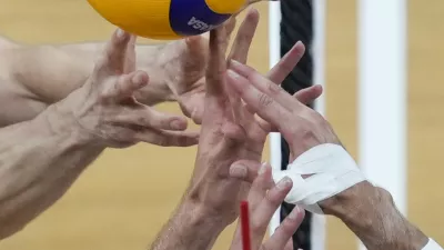 Kevin Tillie, right, of France, tries control the ball against Tobias Brand, left, and Tobias Krick, of Germany during their Volleyball Men's Nations League match at the Mall of Asia Arena in Manila, Philippines on Wednesday, June 19, 2024. (AP Photo/Aaron Favila)