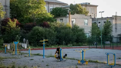 People spend the evening on a playground near a city park, amid Russia's attack on Ukraine, in Kramatorsk, June 21, 2024. REUTERS/Alina Smutko