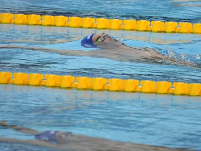 Winner Apostolos Christou of Greece competes during the men's 50m backstroke final at the European Aquatics Championships in Belgrade, Serbia, Friday, June 21, 2024. (AP Photo/Darko Bandic)