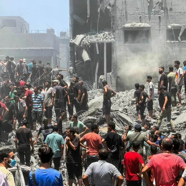 Palestinians search for casualties at the site of Israeli strikes on houses, amid Israel-Hamas conflict, at Al Shati refugee camp in Gaza City, June 22, 2024. REUTERS/Ayman Al Hassi   TPX IMAGES OF THE DAY