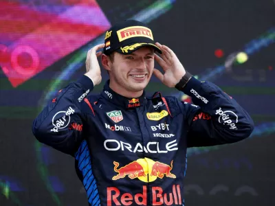 Formula One F1 - Spanish Grand Prix - Circuit de Barcelona-Catalunya, Barcelona, Spain - June 23, 2024 Red Bull's Max Verstappen celebrates on the podium after winning the Spanish Grand Prix REUTERS/Albert Gea