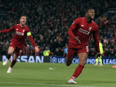 Liverpool's Georginio Wijnaldum celebrates scoring his side's third goal of the game during the Champions League Semi Final, second leg soccer match between Liverpool and Barcelona at Anfield, Liverpool, England, Tuesday, May 7, 2019. (Peter Byrne/PA via AP)