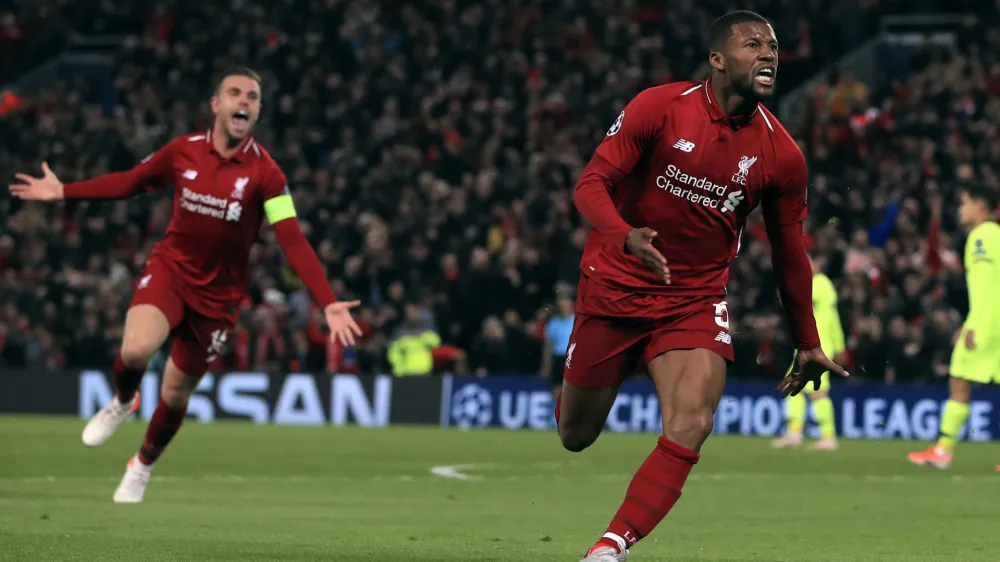 Liverpool's Georginio Wijnaldum celebrates scoring his side's third goal of the game during the Champions League Semi Final, second leg soccer match between Liverpool and Barcelona at Anfield, Liverpool, England, Tuesday, May 7, 2019. (Peter Byrne/PA via AP)