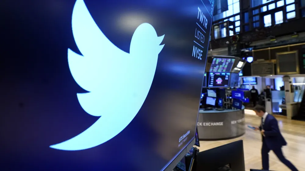 FILE - The logo for Twitter appears above a trading post on the floor of the New York Stock Exchange, Nov. 29, 2021. Startling new revelations from Twitter's former head of security, Peiter Zatko, have raised serious new questions about the security of the platform's service, its ability to identify and remove fake accounts, and the truthfulness of its statements to users, shareholders and federal regulators. (AP Photo/Richard Drew, File)