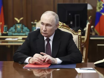 Russian President Vladimir Putin listens to VTB Bank Chairman Andrei Kostin during their meeting at the Kremlin in Moscow, Russia, Monday, June 24, 2024. (Vyacheslav Prokofyev, Sputnik, Kremlin Pool Photo via AP)