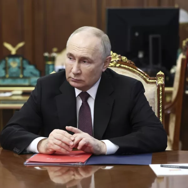 Russian President Vladimir Putin listens to VTB Bank Chairman Andrei Kostin during their meeting at the Kremlin in Moscow, Russia, Monday, June 24, 2024. (Vyacheslav Prokofyev, Sputnik, Kremlin Pool Photo via AP)