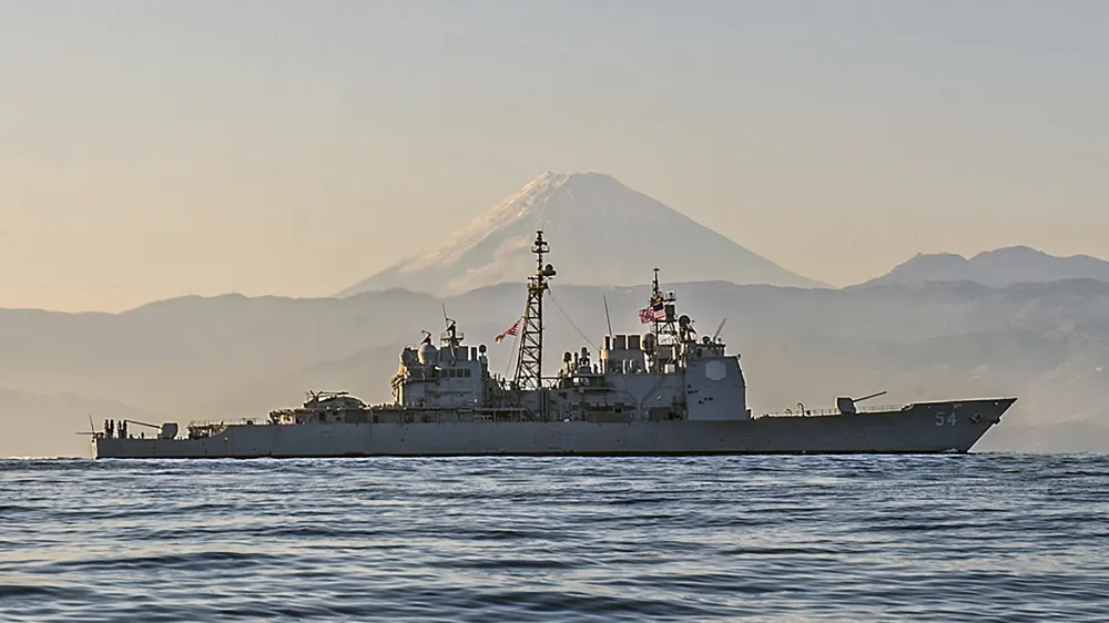 Ticonderoga-class guided-missile cruiser USS Antietam (CG 54) is underway off the coast of Japan near Mt. Fuji. Antietam is on patrol in the 7th Fleet area of operations in support of security and stability in the Indo-Asia-Pacific region, Nov. 22, 2014. The U.S. Navy is sailing the USS Antietam and the USS Chancellorsville warships through the Taiwan Strait Sunday, in the first such transit publicized since US House Speaker Nancy Pelosi visited Taiwan earlier in August, at a time where tensions have kept the waterway particularly busy. (Mass Communication Specialist Seaman David Flewellyn/U.S. Navy via AP)