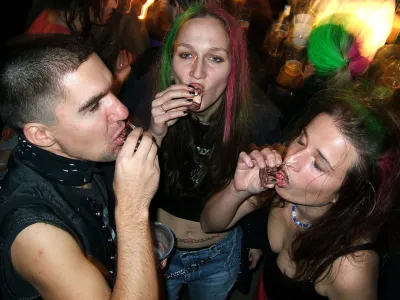 People slam shots of vodka to celebrate during a New Years party in a bar in downtown Prague, Czech Republic, Dec. 31, 2004. Drinking is a national pastime in this beer-loving country, but authorities and health experts concede they've got trouble on their hands: a growing number of underaged youths, some as young as 10, who are hitting the bottle regularly. (AP Photo/Petr David Josek)