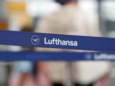 FILE PHOTO: Logo of Lufthansa is seen as passengers wait at Munich Airport during a warning strike staged by Lufthansa ground staff over 9.5 % pay claim by Germany's public sector workers union Verdi in Munich, Germany July 27, 2022. REUTERS/Michaela Rehle//File Photo