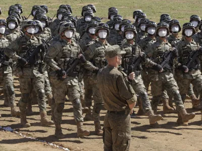 In this handout photo released by Russian Defense Ministry Press Service, Chinese troops march during the Vostok 2022 military exercise at a firing range in Russia's Far East, Wednesday, Aug. 31, 2022. Russia on Thursday launched weeklong war games involving forces from China and other nations in a show of growing defense cooperation between Moscow and Beijing, as they both face tensions with the United States. (Vadim Savitsky/Russian Defense Ministry Press Service via AP)