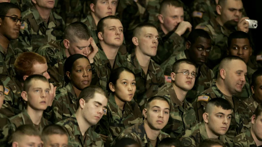 Army troops from Fort Riley, Kan., listen to President Bush deliver a speech about the war on terror during the Landon Lecture at Kansas State University Monday, Jan. 23, 2006 in Manhattan, Kan.. (AP Photo/Charlie Riedel)