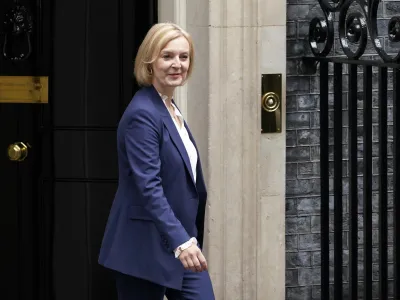 Britain's new Prime Minister Liz Truss leaves 10 Downing Street to attend her first Prime Minister's Questions, in London, Wednesday, Sept. 7, 2022. (AP Photo/Alberto Pezzali)