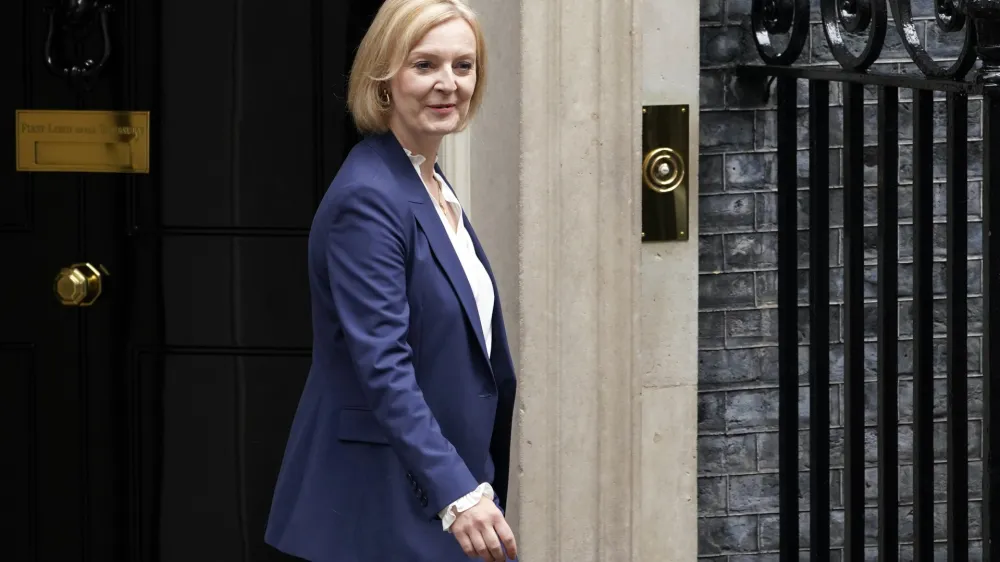 Britain's new Prime Minister Liz Truss leaves 10 Downing Street to attend her first Prime Minister's Questions, in London, Wednesday, Sept. 7, 2022. (AP Photo/Alberto Pezzali)