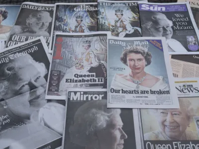 Newspapers devoted to the death of Queen Elizabeth II are seen in Manchester, England, Friday, Sept. 9, 2022. Queen Elizabeth II, Britain's longest-reigning monarch, died on Thursday Sept. 8 aged 96. (AP Photo/Jon Super)