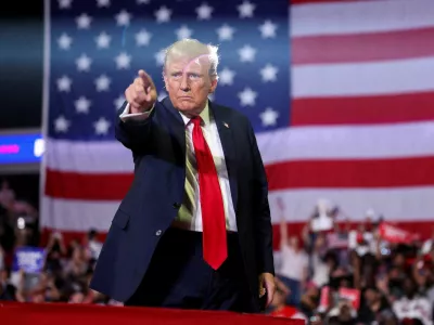 FILE PHOTO: Former U.S. President and Republican presidential candidate Donald Trump gestures during a campaign event in Philadelphia, Pennsylvania, U.S., June 22, 2024. REUTERS/Tom Brenner/File Photo